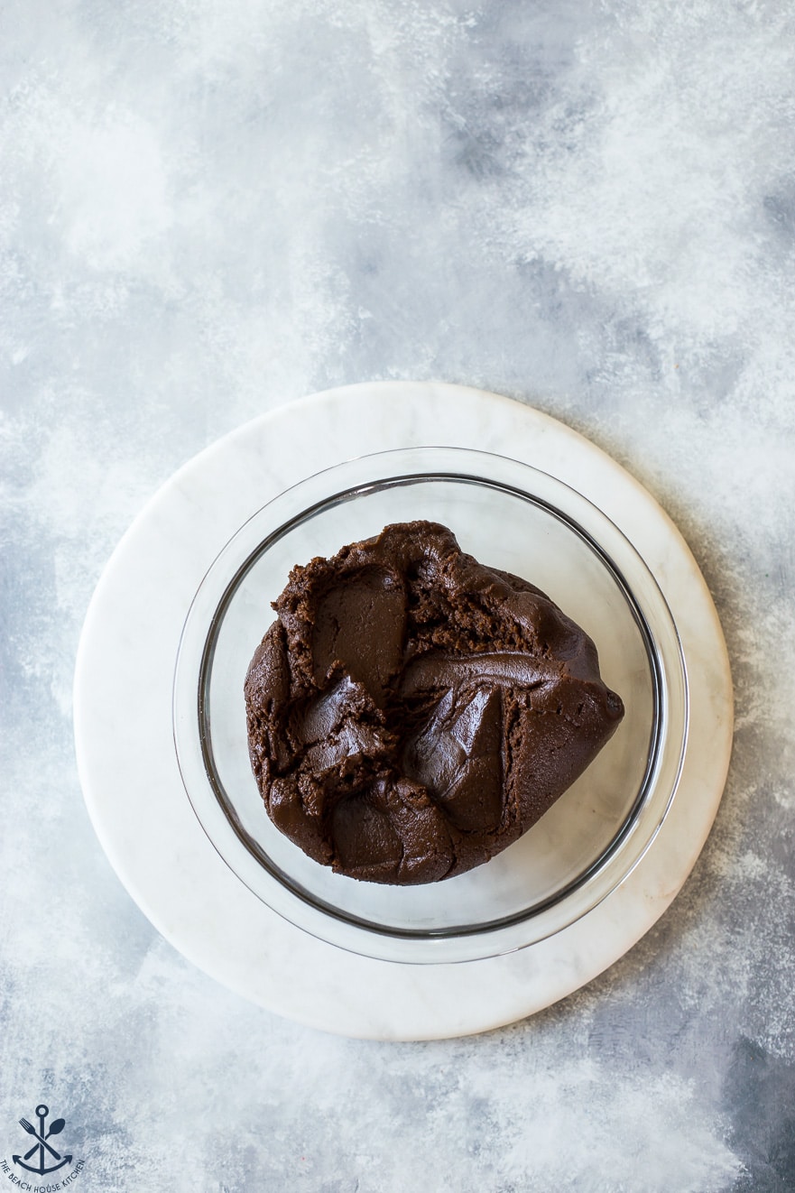 Chewy Chocolate Gingersnap Cookies dough in a glass bowl