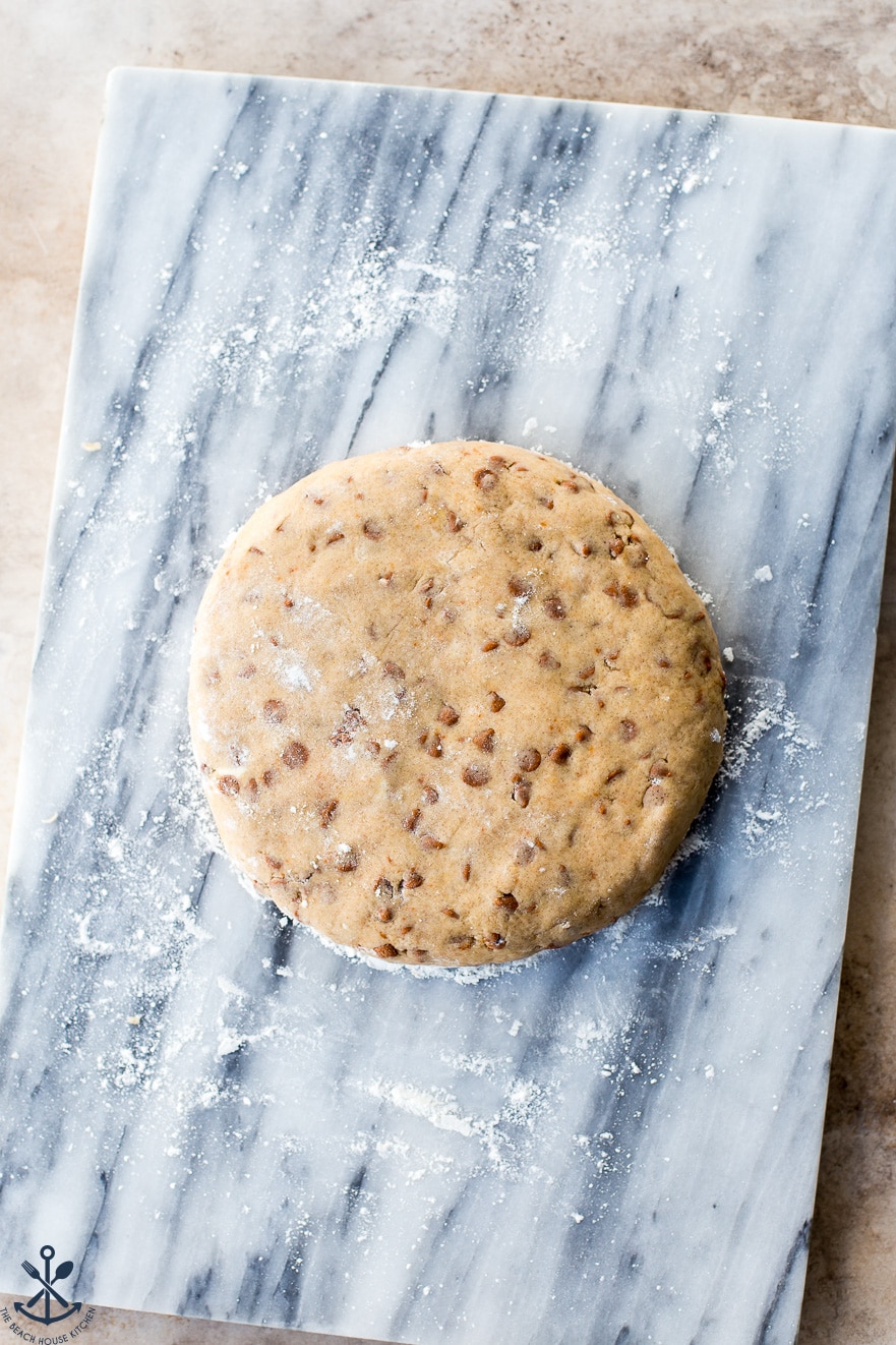 Overhead photo of scone dough on a marble coard