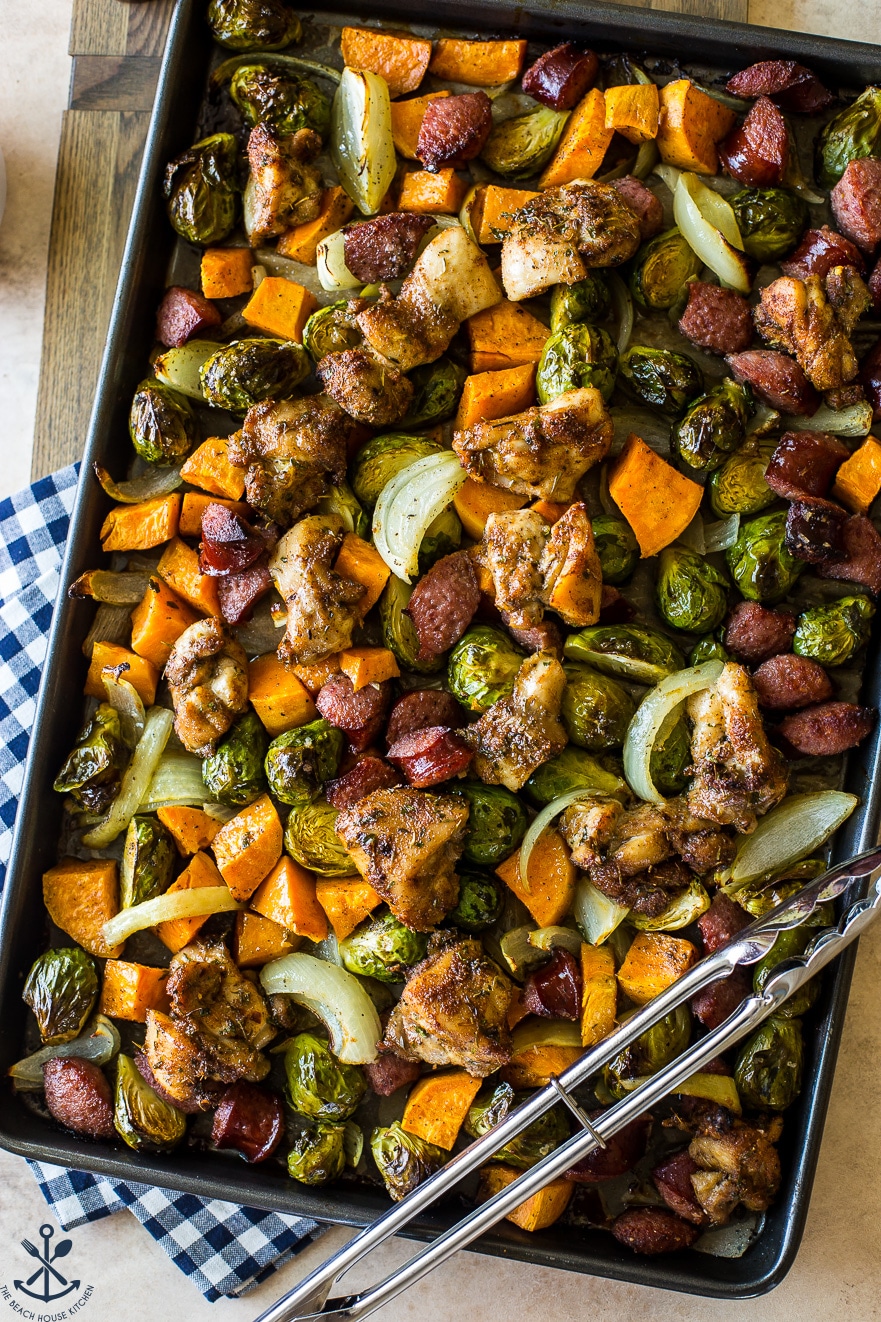 Overhead up close photo of chicken thigh sheet pan dinner with sweet potatoes and Brussels sprouts