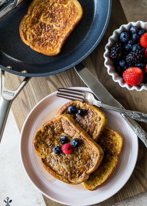 Overhead photo of stack of chai french toast on a plate topped with berries