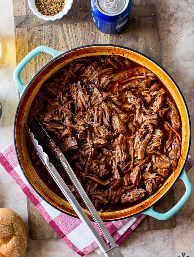 Overhead photo Beer-Braised BBQ Chuck Roast in a Dutch oven