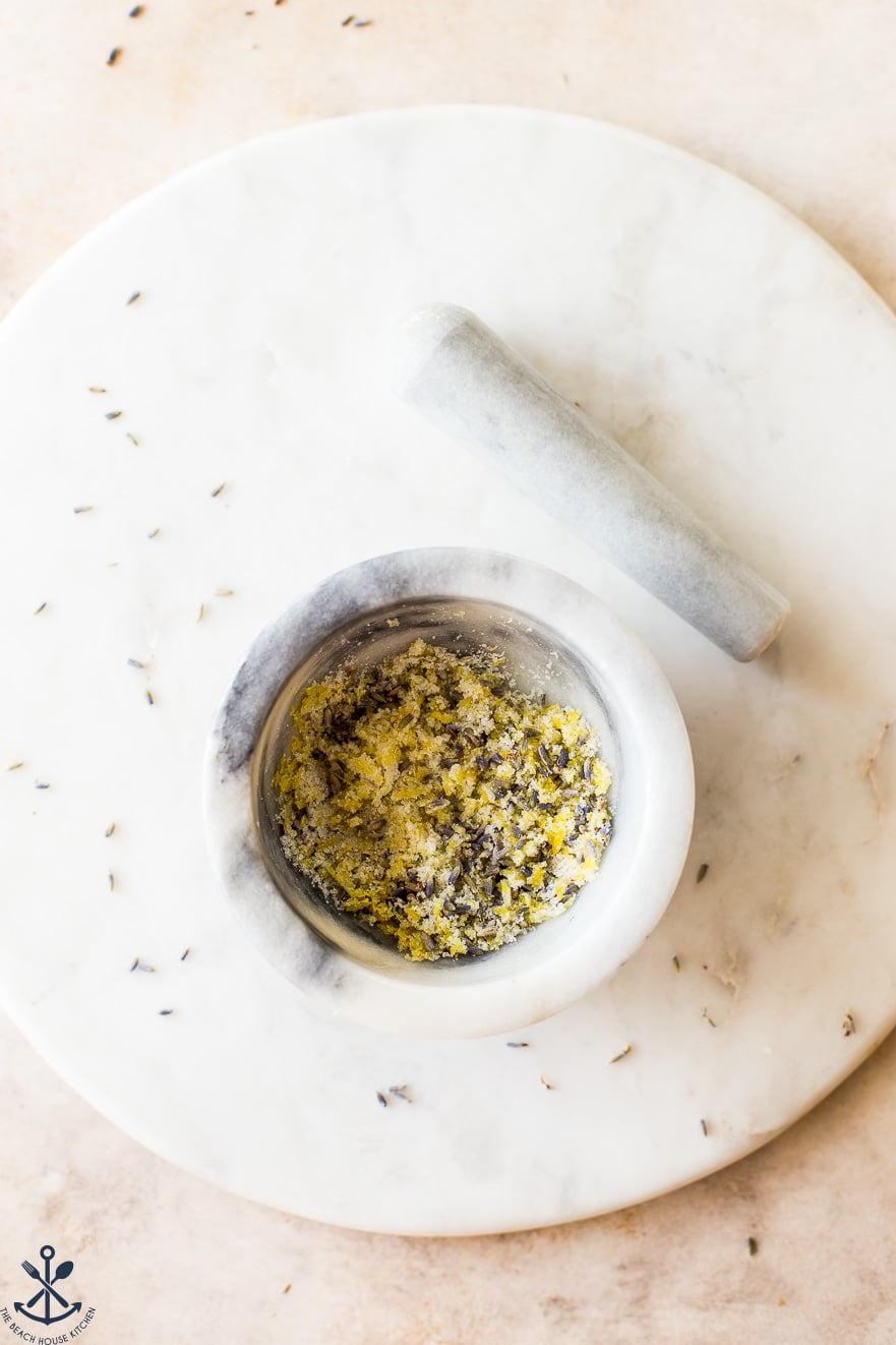 Up close overhead photo of a bowl filled with a lemon lavender sugar mixture