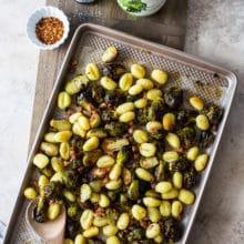 Overhead photo of a sheet pan meal with brussels sprouts, gnocchi and pancetta