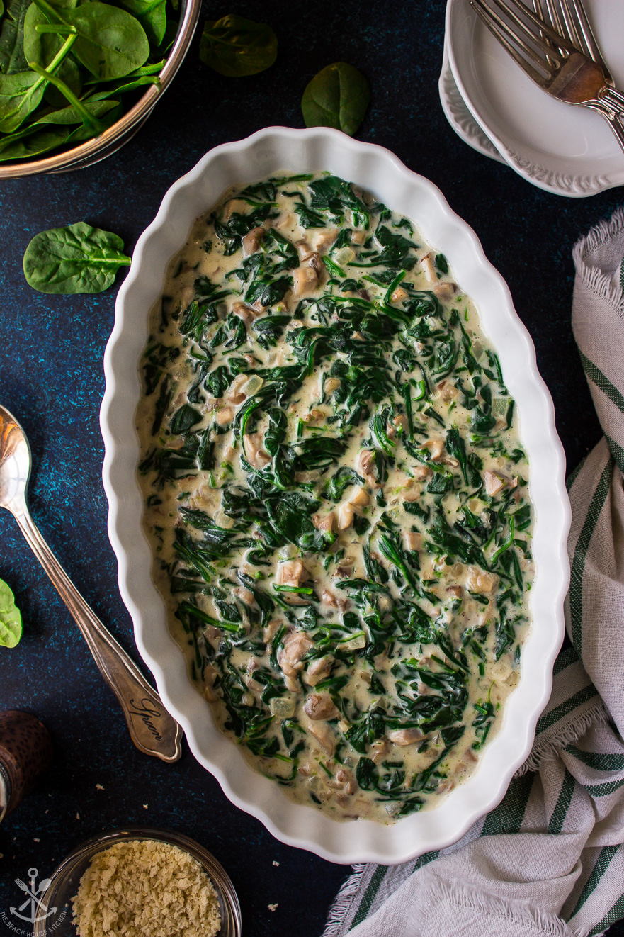 Overhead photo of Creamed Spinach and Mushrooms in an oval white dish