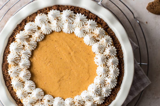 Overhead photo of a whipped cream topped pumpkin chiffon pie