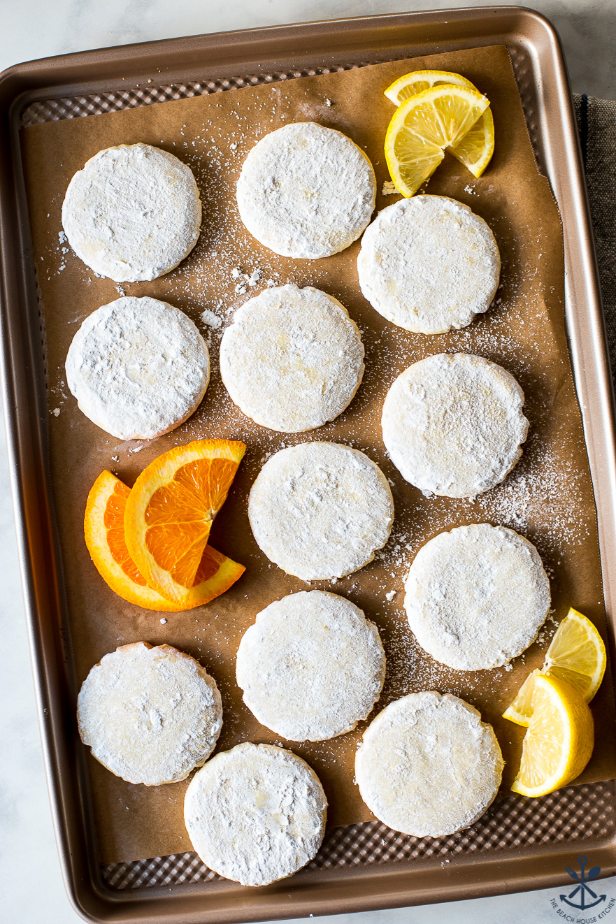 An overhead photo of a tray of citrus meltaways with orange and lemon slices