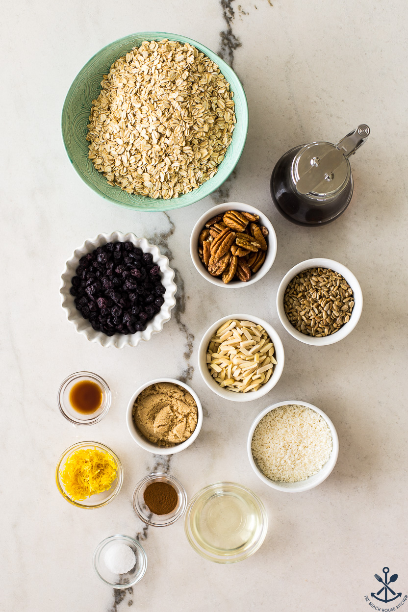 Overhead photo of bowls filled with blueberry lemon granola ingredients