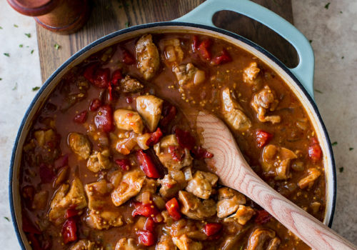 Overhead photo of a skillet of chicken vindaloo