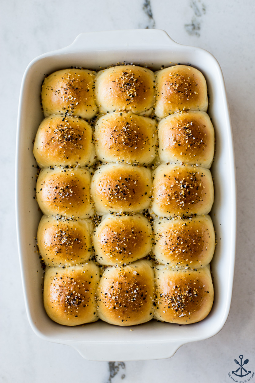 Up close overhead photo of a baking dish of everything dinner rolls