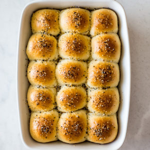 Overhead photo of a baking dish of Soft Everything Dinner Rolls
