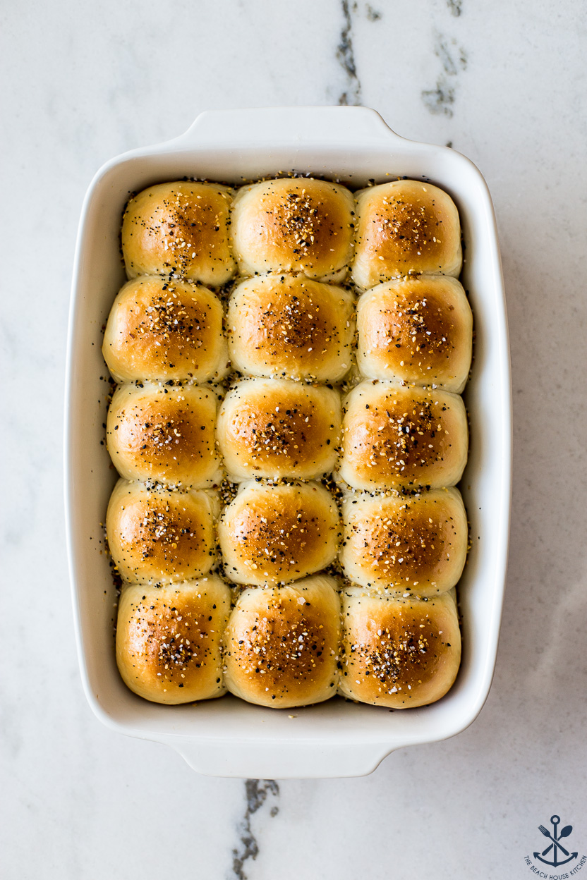 Overhead photo of a baking dish of Soft Everything Dinner Rolls