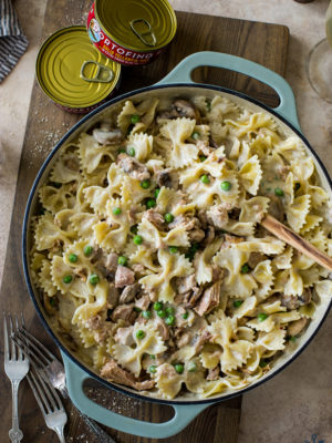 Overhead photo of a skillet of pasta with peas mushrooms and tuna