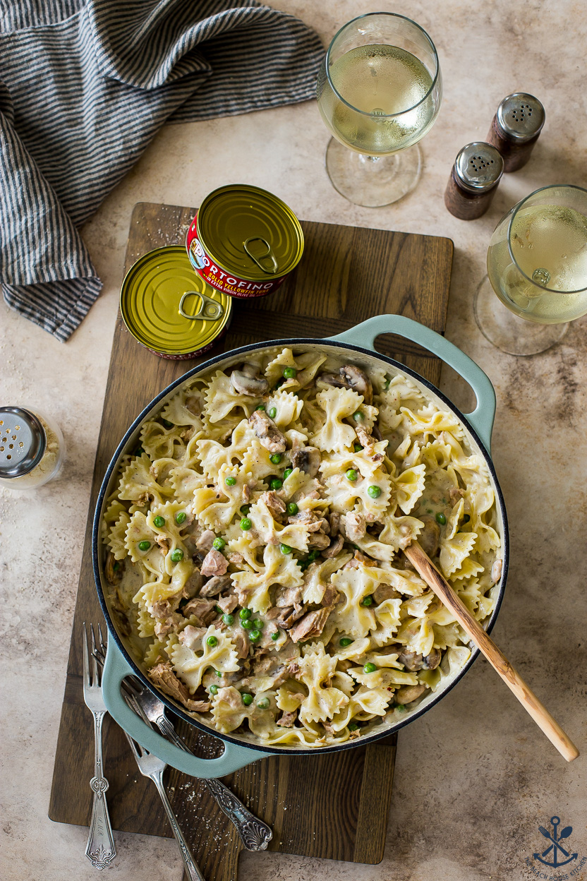 Overhead photo of a skillet of tuna pasta with mushrooms and peas