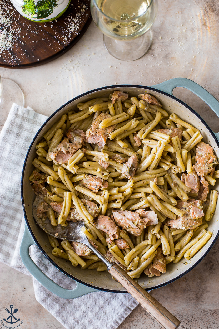 Overhead photo of a large baking dish of pasta with salmon