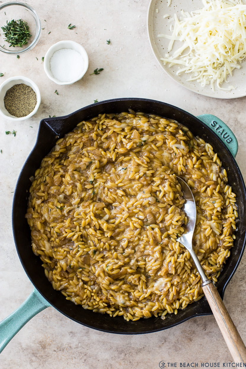 Overhead photo of a skillet of French Onion Orzo