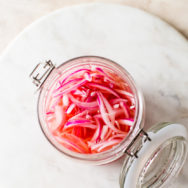 Overhead photo of a jar of pickled red onions