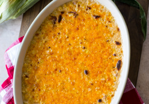 Overhead photo of a baking dish of cheesy corn