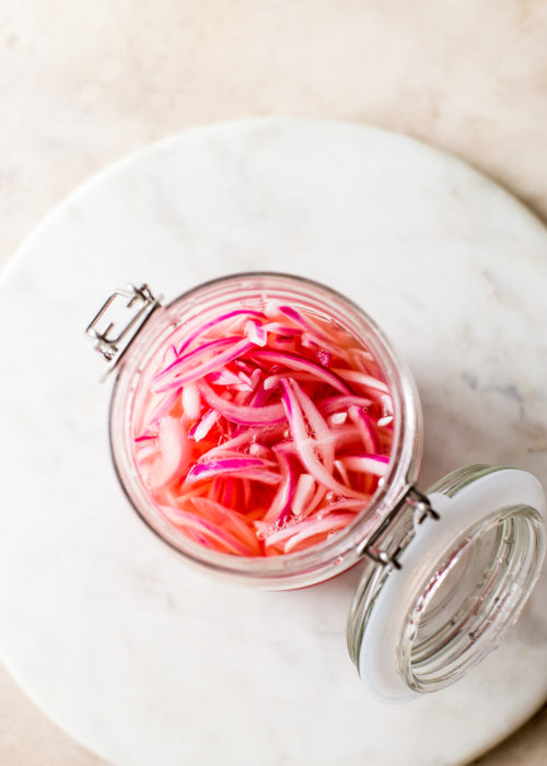 Overhead photo of a jar of pickled red onions