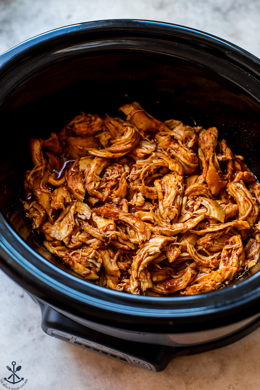 Shredded honey chipotle chicken in a slow cooker