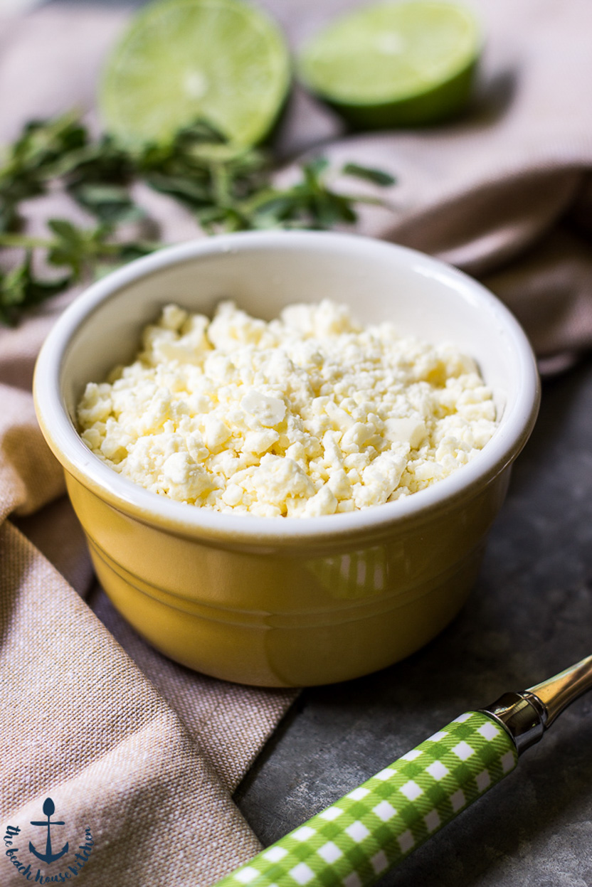Up close photo of a small bowl of crumbled Cotija cheese