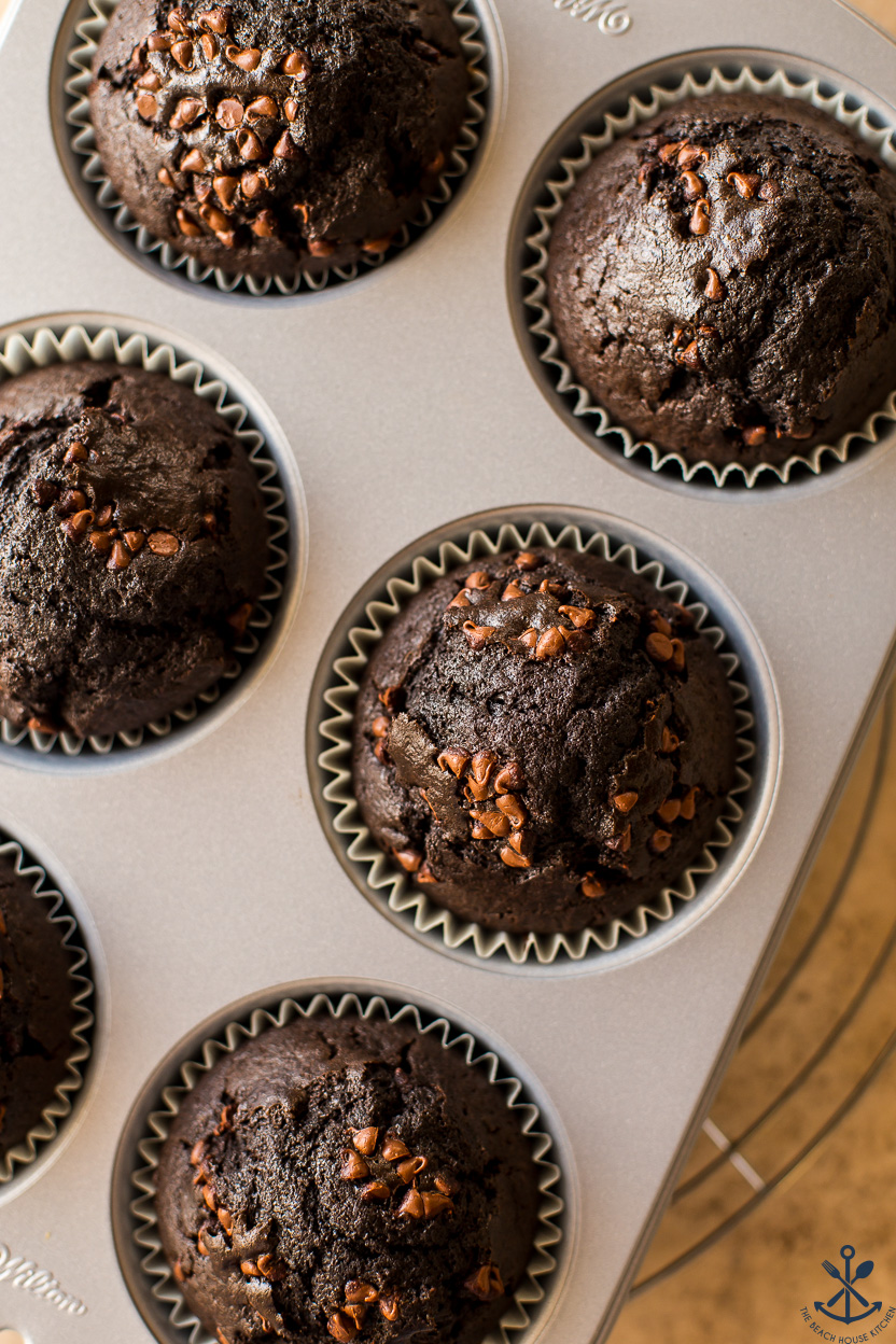 Up close overhead photo of dark chocolate muffins with mini chocolate chips