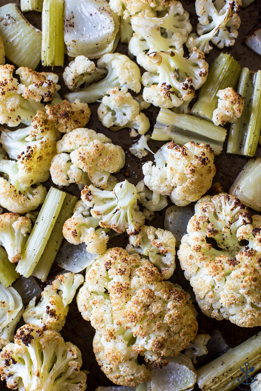 A tray of cooked cauliflower onions and celery