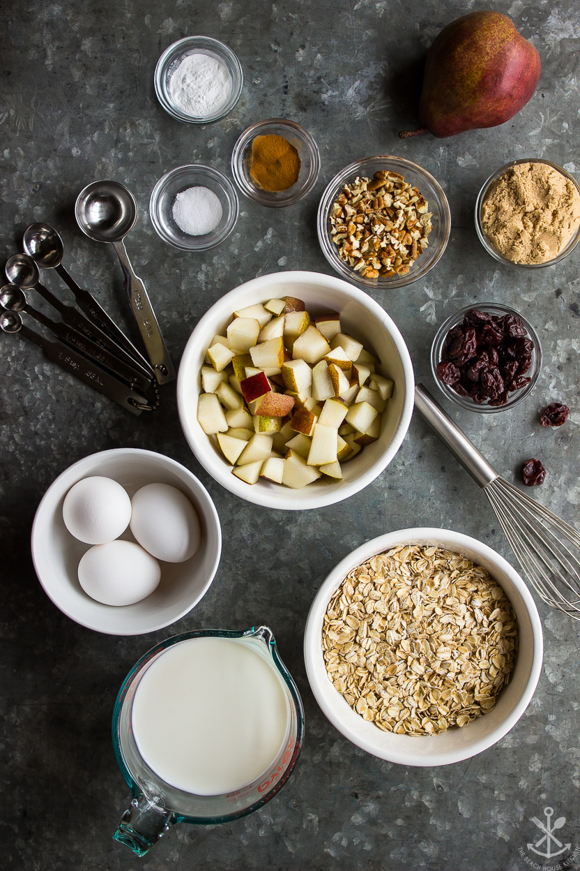 Overhead photo of ingredients for a baked oatmeal with dried cherries and pears