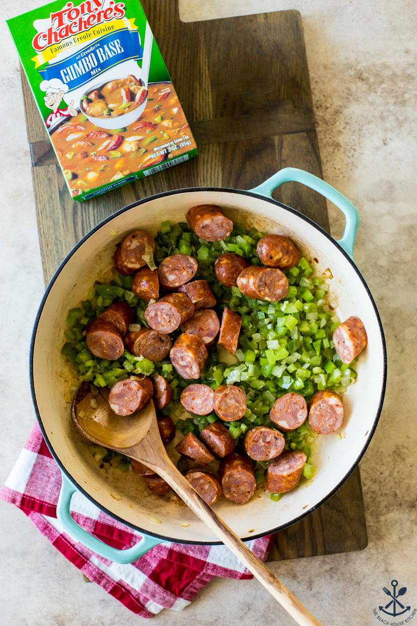 Overhead photo of a skillet of veggies and andouille sausage