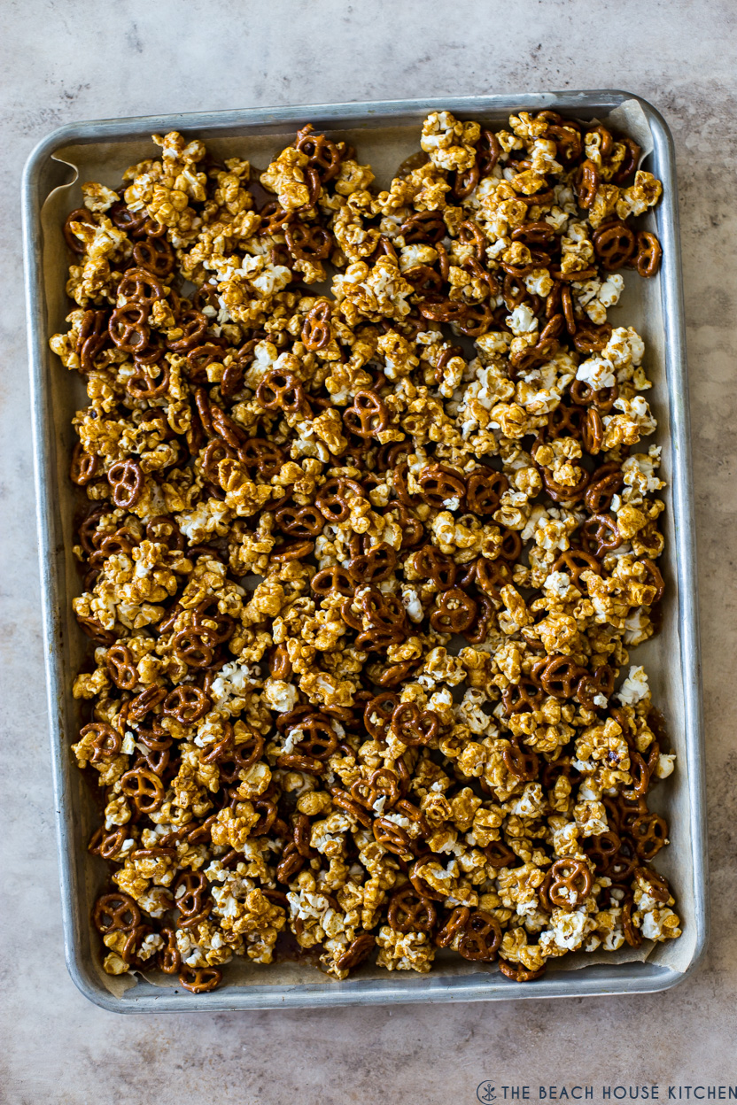 Overhead photo of a tray of caramel popcorn with pretzels