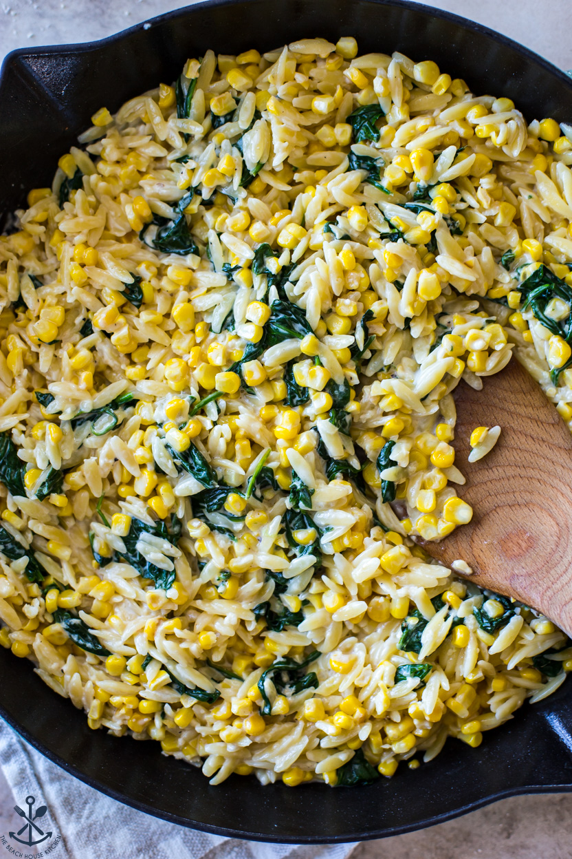 Up close overhead photo of a skillet filled with a corn mixture