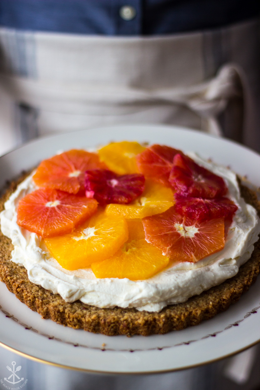 Up close photo of a tart topped with oranges