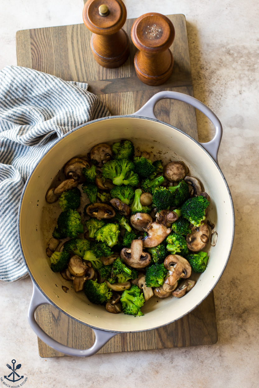 Overhead photo of a pot of broccoli and mushrooms