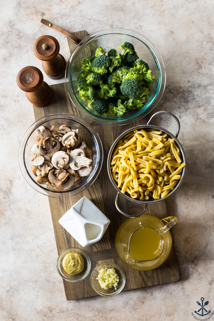 Overhead photo of ingredients for a broccoli and mushroom pasta dish