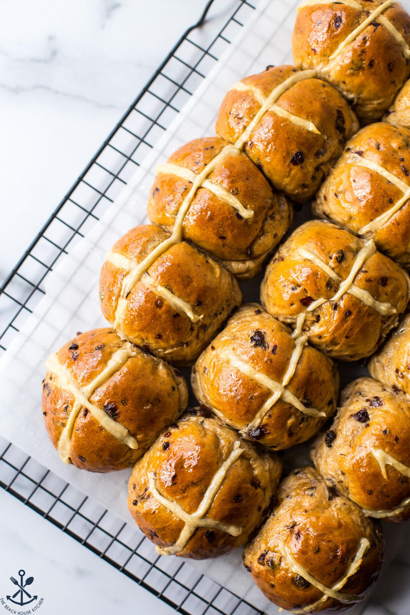 Overhead photo of hot cross buns on a wire rack