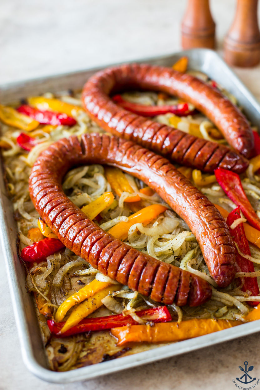 A Sheet Pan of Hasselback Kielbasa and onions and peppers