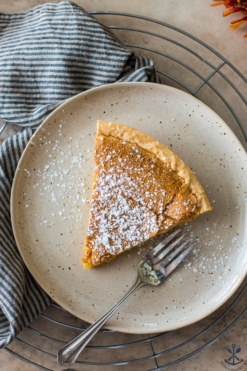 Up close overhead photo of a slice of lemon chess pie
