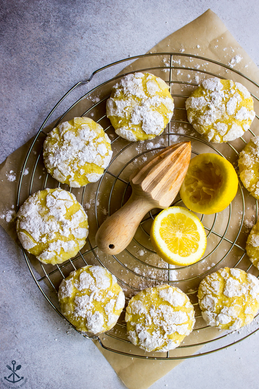 Overhead photo of lemon crinkle cookies on a round wire rack