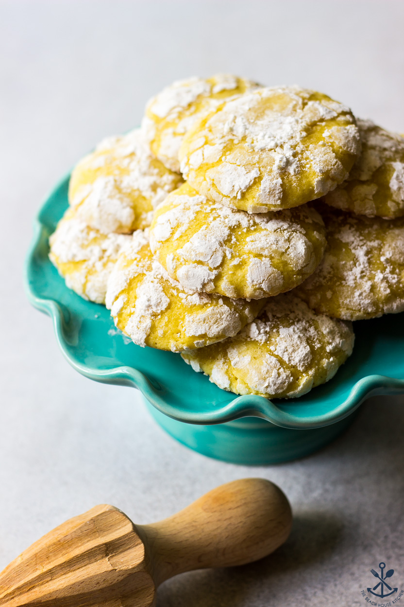 A small cake stand topped with lemon crinkle cookies