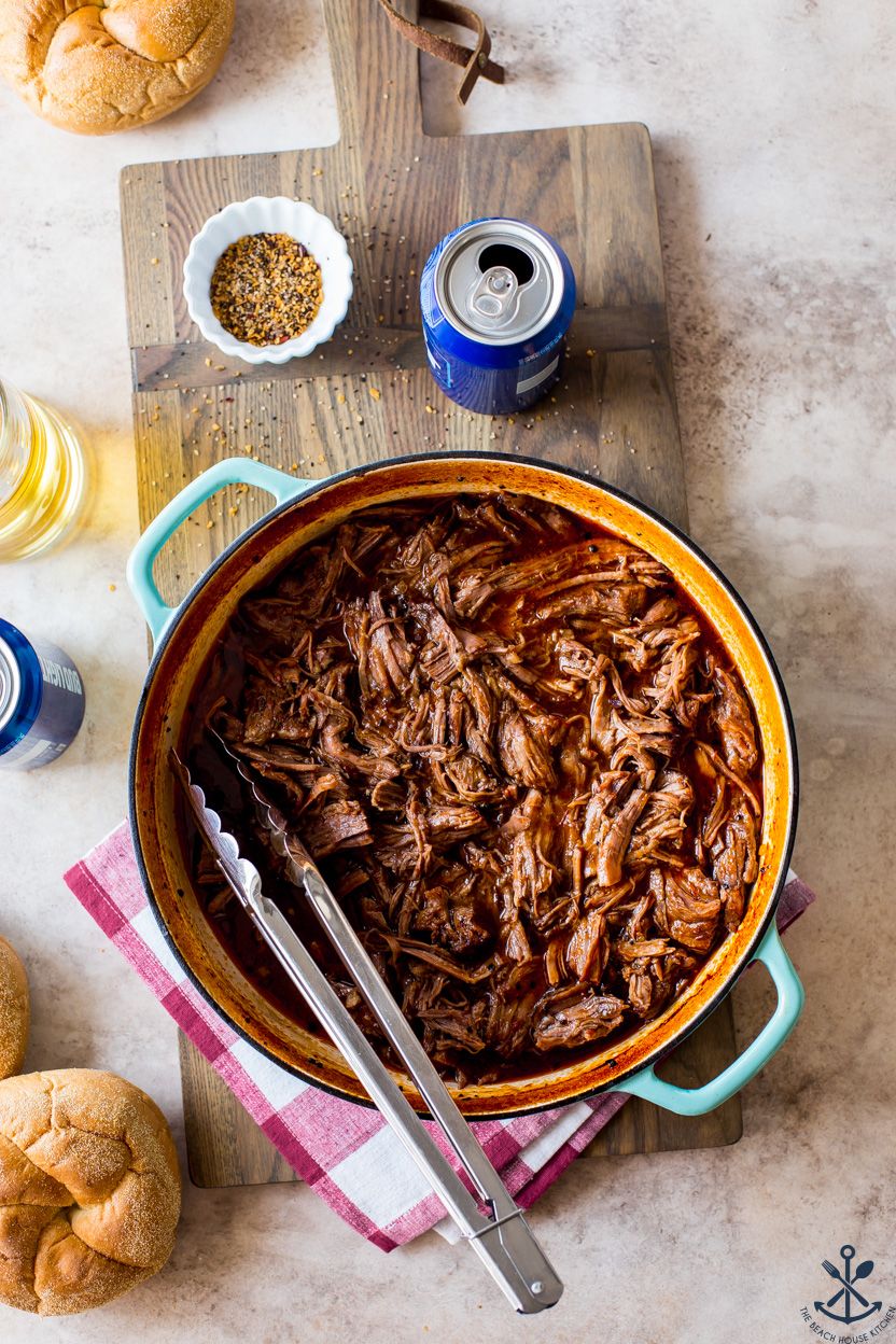 Overhead photo of a skillet of Beer-Braised BBQ Chuck Roast