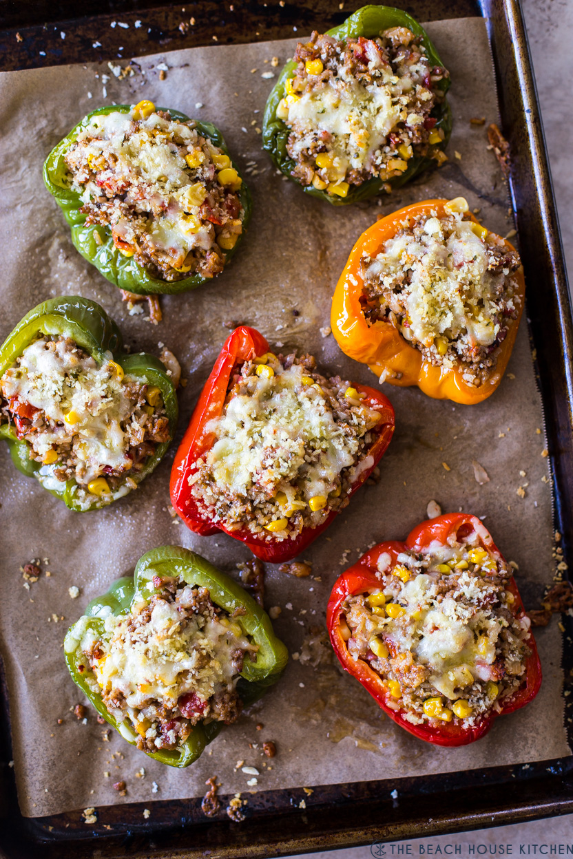 Overhead photos of stuffed peppers on a parchment lined baking sheet