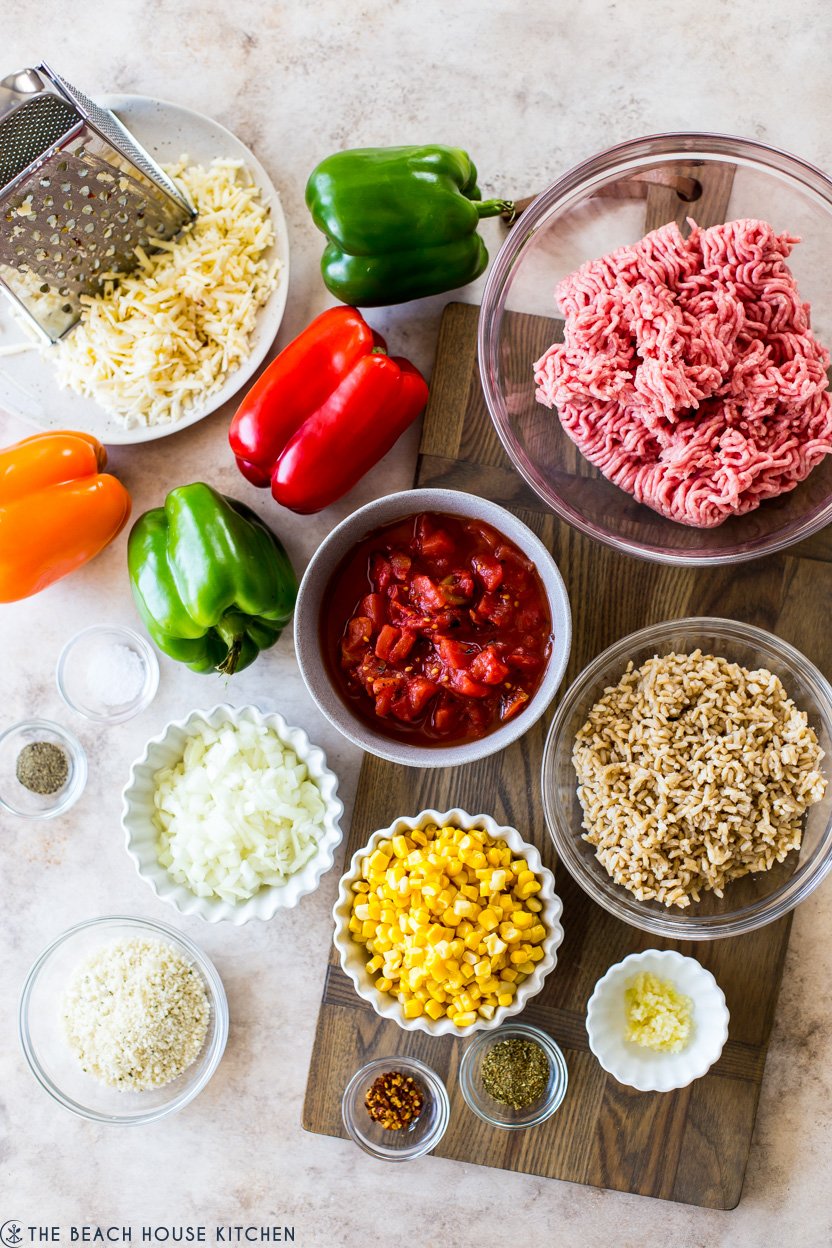 Overhead photo of ingredients for stuffed peppers in bowls