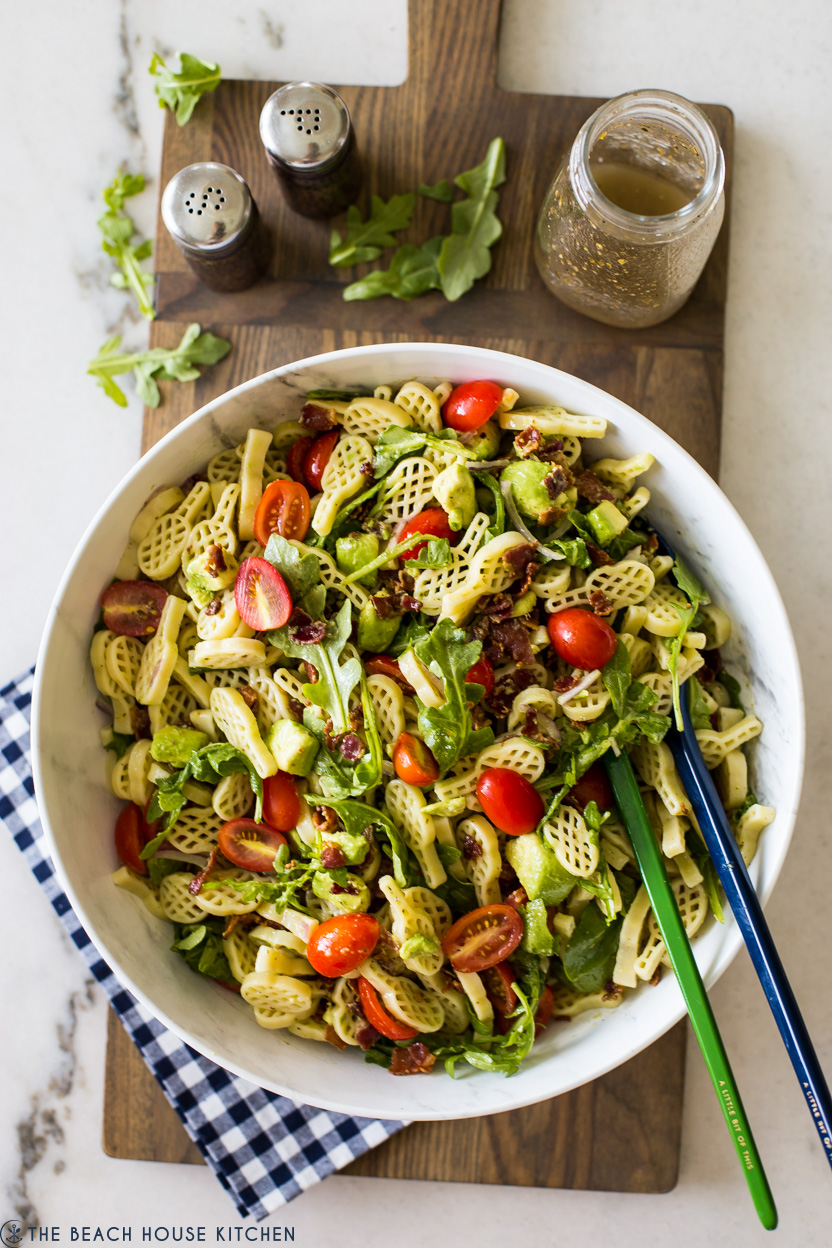 Overhead photo of a bowl of pasta salad with bacon, tomatoes and avocado