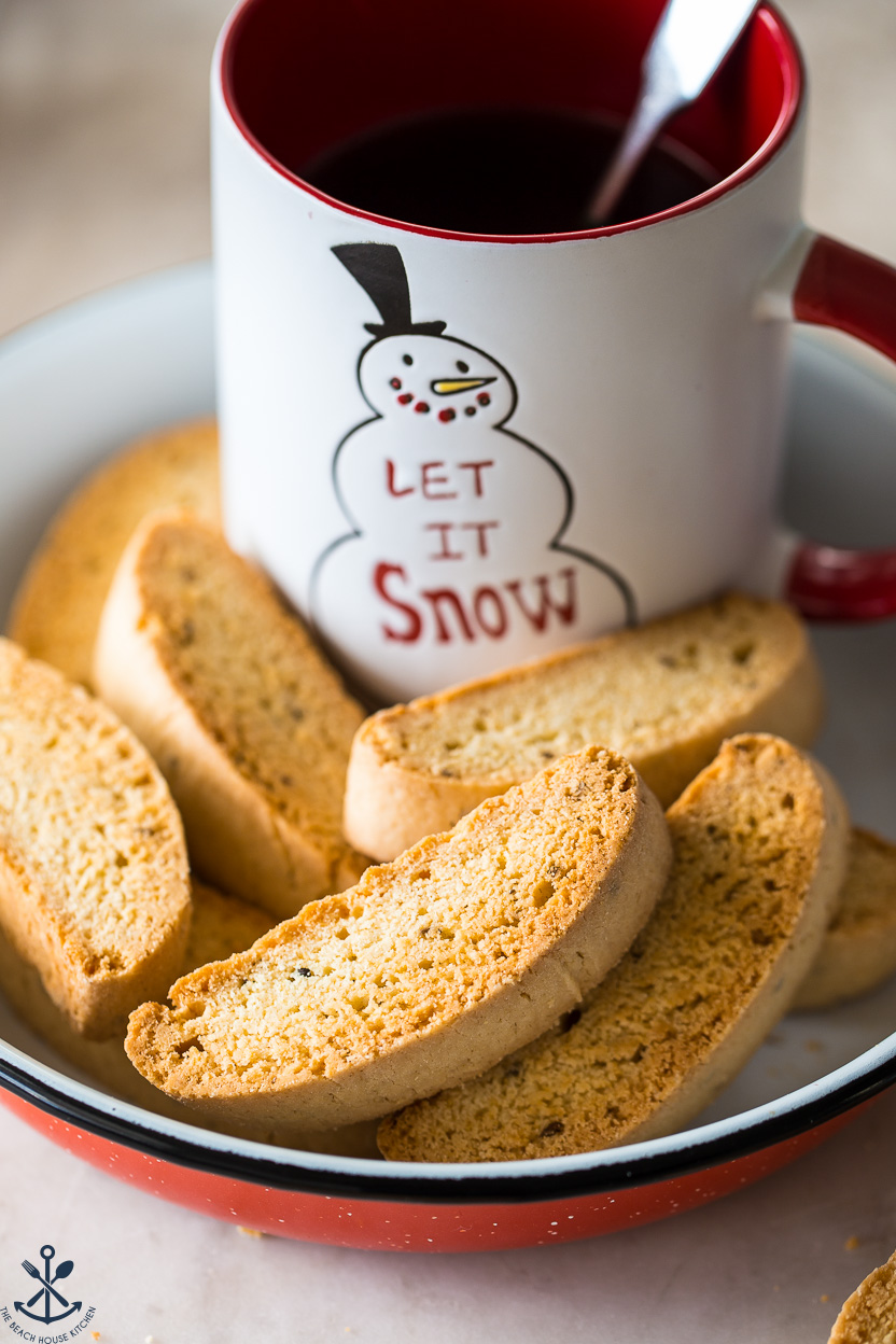 Up close photo of a plate of biscotti and a mug of hot cocoa