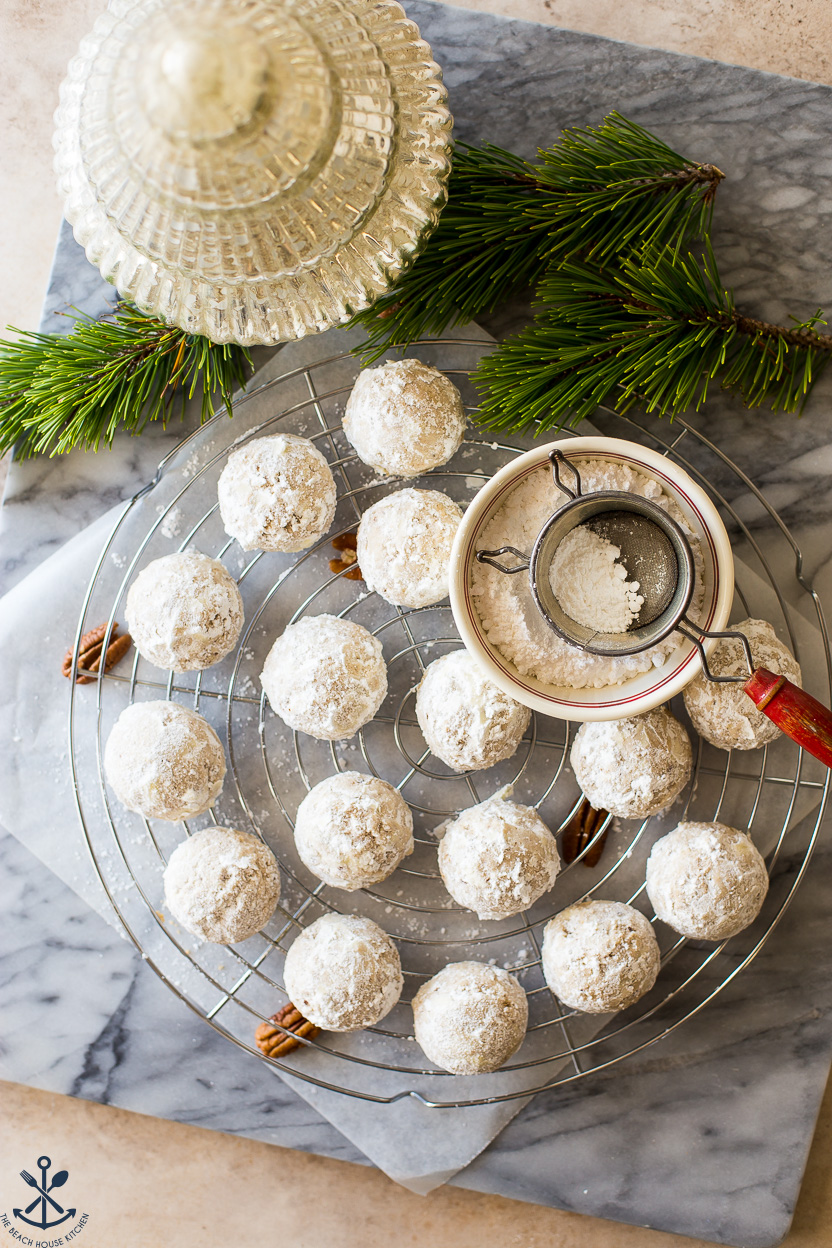 Overhead photo of maple pecan snowball cookies on a wire rack