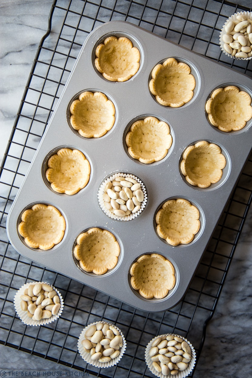 Overhead photo of mini pie shells in a mini muffin tin