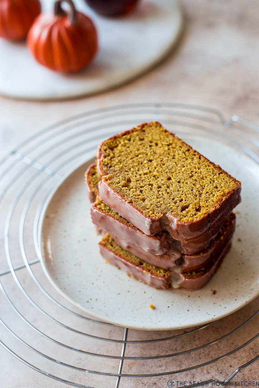 A stack of pumpkin bread slices on a plate