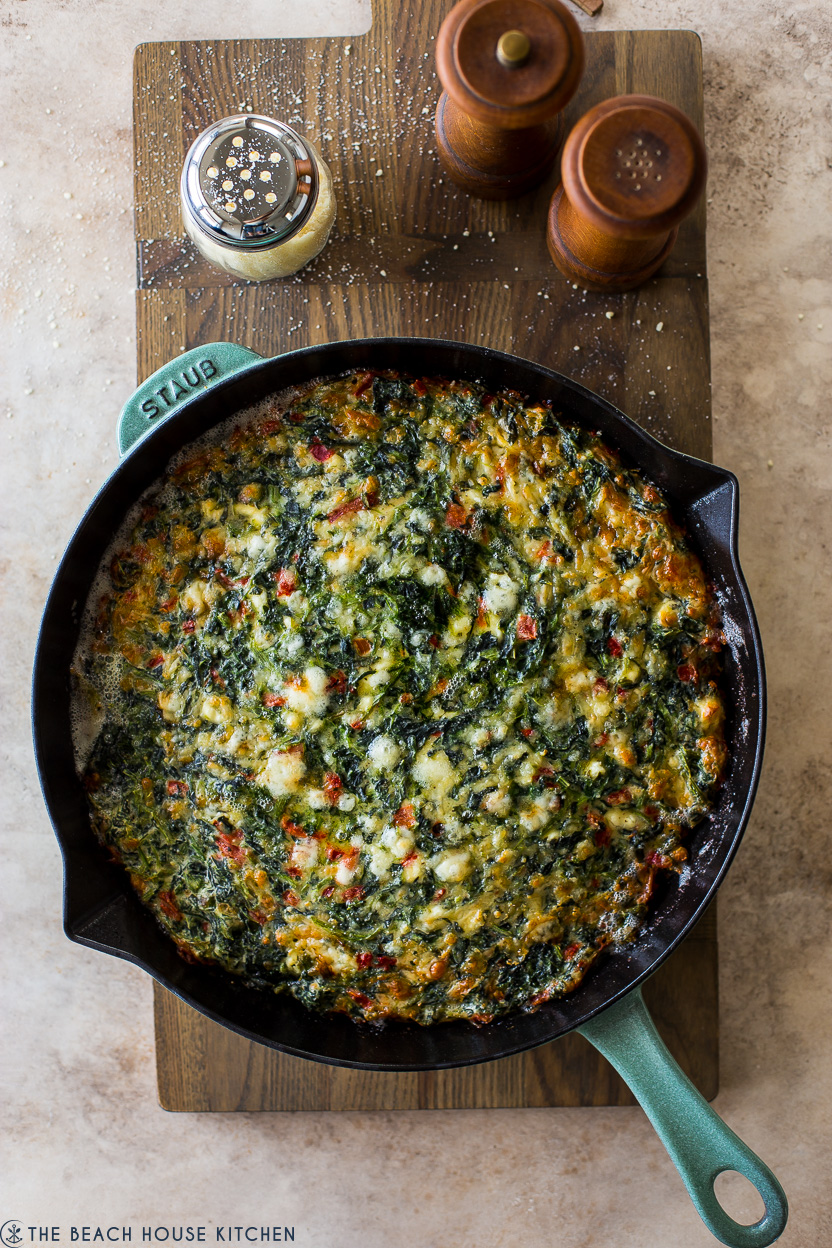 Overhead photo of a spinach egg bake in a skillet