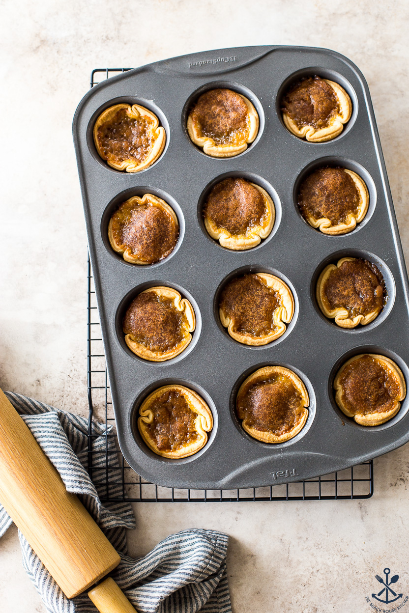 A muffin pan filled with butter tarts