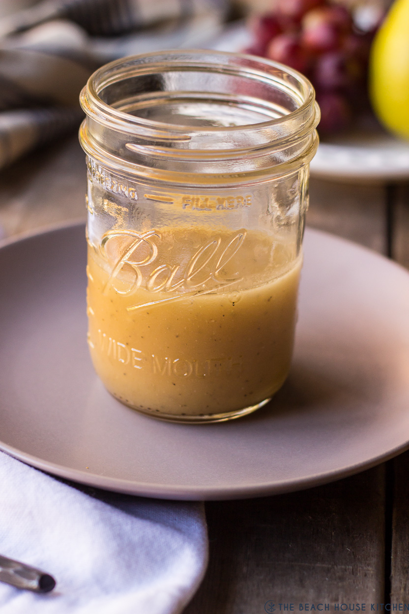 A jar of dressing on a plate