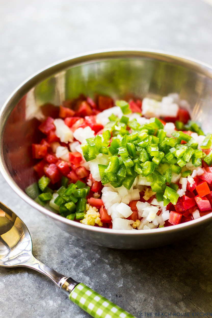 A bowl with ingredients for pico de gallo
